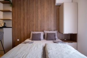 Una cama o camas en una habitación de Apartman Julija