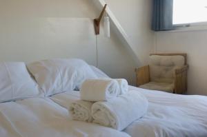 Postel nebo postele na pokoji v ubytování Strandhotel Terschelling B&B
