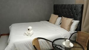 Ένα ή περισσότερα κρεβάτια σε δωμάτιο στο Spring forth guest house