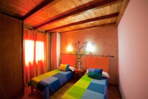 Cama o camas de una habitación en Casa Rural El Taller De Benito