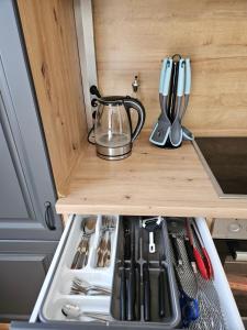 a drawer in a kitchen with a tea kettle on it at MaxMir - Ortlohn Iserlohn in Iserlohn