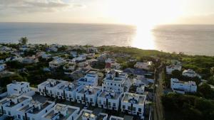 an aerial view of houses and the ocean at Paddington House - private pool & rooftop in Flic-en-Flac