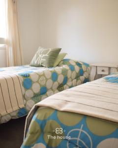 a bedroom with a bed with a pillow on it at The House in City Bell +22 photos
