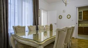 a dining room with a glass table and chairs at Apartment in city center of Belgrade in Belgrade