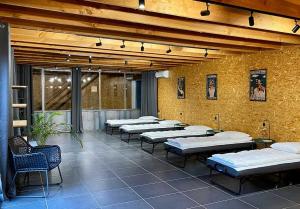 a room with several mattresses lined up against a wall at Loft Bike & Chill in Entrechaux