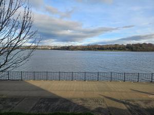 a view of a large body of water at Spacious Riverfront Apartment in Pennyburn +4 photos