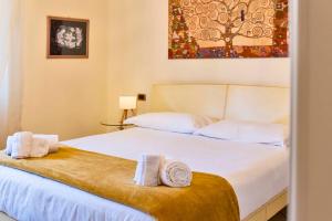 Postel nebo postele na pokoji v ubytování GOLDEN LUXE - 3 camere a 100 passi dal mare