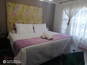 Postel nebo postele na pokoji v ubytování Kulungile Guest House