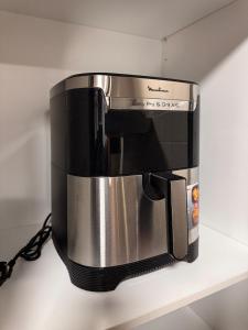 a coffee maker is sitting on a shelf at Brisa Atlántica in Ponteareas +19 photos