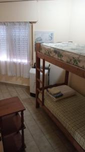 Ένα ή περισσότερα κρεβάτια σε δωμάτιο στο a TRES MIN DEL CENTRO +2 φωτογραφίες