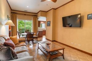 a living room with a couch and a table at CR Luxury Veranda 7B 2 Bdrm in La Mona