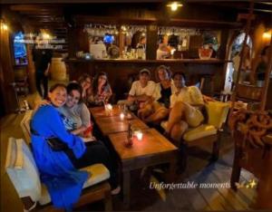 a group of people sitting in a restaurant at story house salah in Rabat