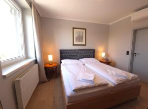 Postel nebo postele na pokoji v ubytování Guesthouse Purbach