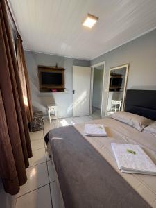 Телевизор и/или развлекательный центр в Casa Verde - 5 quartos a 600m Praia e próximo Beto Carrero