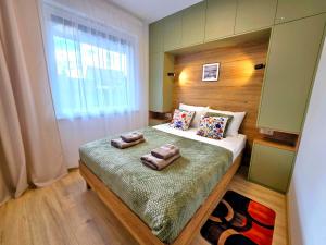 Ένα ή περισσότερα κρεβάτια σε δωμάτιο στο Apartament Miro