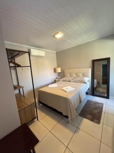 Кровать или кровати в номере Casa Verde - 5 quartos a 600m Praia e próximo Beto Carrero