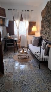 a living room with a bed and a table in it at LAZURITE MASPALOMAS Apartamentos Sur Gran Canaria in Maspalomas +64 photos