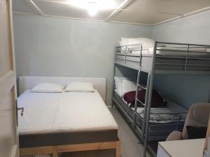 a small room with two bunk beds in it at Holiday Riverside Beach Camping in Gol