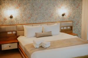 Postel nebo postele na pokoji v ubytování Goland Hotel