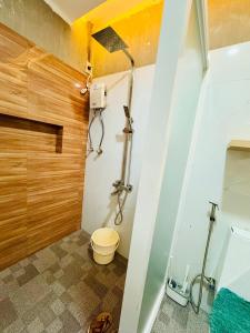 a bathroom with a shower and a toilet at Santa Ana Transient House in Sampong +7 photos