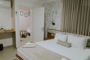 Postel nebo postele na pokoji v ubytování Goland Hotel