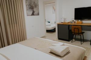 Postel nebo postele na pokoji v ubytování Goland Hotel