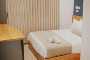 Postel nebo postele na pokoji v ubytování Goland Hotel