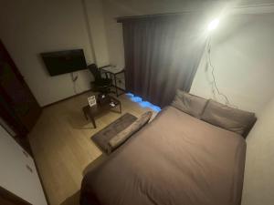 Postel nebo postele na pokoji v ubytování Apartment Hotel Kuki