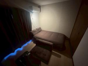 Postel nebo postele na pokoji v ubytování Apartment Hotel Kuki