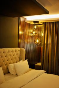 Giường trong phòng chung tại Gold Crest Grand Mall Luxury Apartments by Alvis Suite +251 ảnh