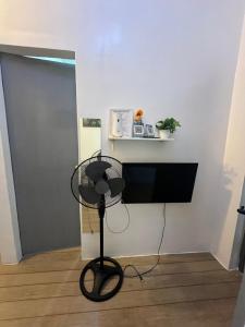a black fan in a room with a wall at San Jose del monte Bulacan gumaok with aircon unit 1 in Mangangpico