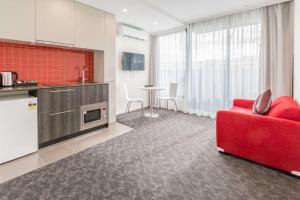 Kuchyň nebo kuchyňský kout v ubytování Comfort Apartments Box Hill