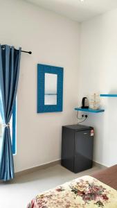 Ένα ή περισσότερα κρεβάτια σε δωμάτιο στο Cabana Chalet Cherating