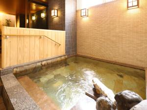 a large pool of water in a room with at Dormy Inn Sapporo Annex in Sapporo