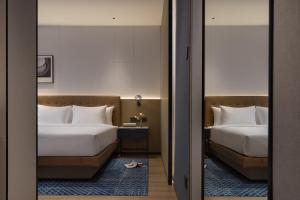 Letto o letti in una camera di Four Points by Sheraton Kunming Dongfeng Square