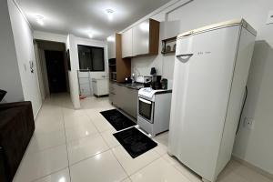 Dapur atau dapur kecil di Edifício com Ótima localização e Conforto