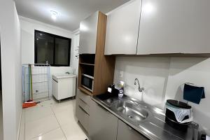 Dapur atau dapur kecil di Edifício com Ótima localização e Conforto
