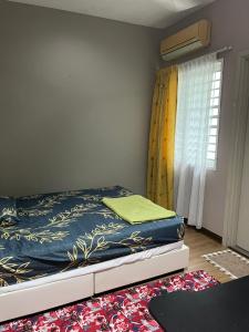 Ένα ή περισσότερα κρεβάτια σε δωμάτιο στο K2 Villas Homestay