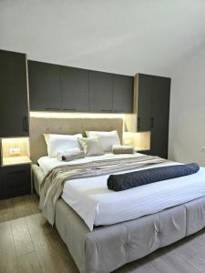 Postel nebo postele na pokoji v ubytování V&L Apartman