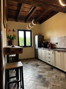 a kitchen with a refrigerator and a table in it at Stone House Bran in Bran