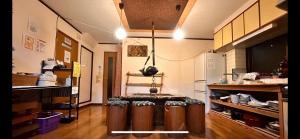 a kitchen with a table in the middle of a room at Numazu Ikyuuan 沼津一休庵 in Numazu