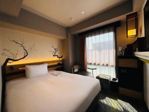 Letto o letti in una camera di Shizutetsu Hotel Prezio Kyoto Karasumaoike
