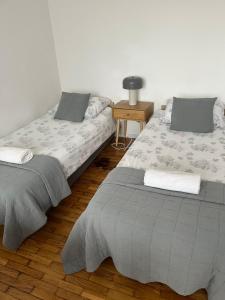 Posteľ alebo postele v izbe v ubytovaní Apartament Centrum