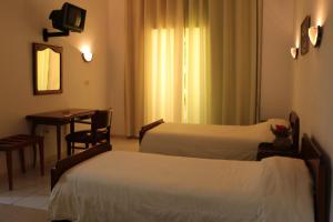 En eller flere senge i et værelse på Hotel Saint Georges Tunis