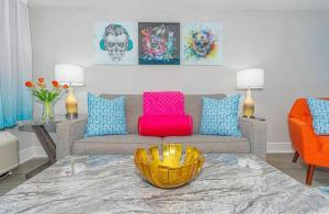 a living room with a couch and a table at Ocean Front Beach'n 1BR Premium Condos in Myrtle Beach