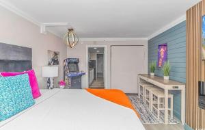 a bedroom with a large bed and a desk at Ocean Front Beach'n 1BR Premium Condos in Myrtle Beach +52 photos