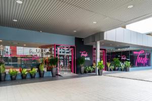 a store front with potted plants in front of it at MagTree Chinatown in Kuala Lumpur