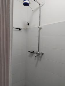 a bathroom with a shower with a faucet at Luxe 1 bedroom chui Villa View in Munyu +11 photos