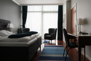 Postel nebo postele na pokoji v ubytování Helnan Marselis Hotel
