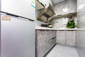 Kuchyň nebo kuchyňský kout v ubytování Sakura Apartment